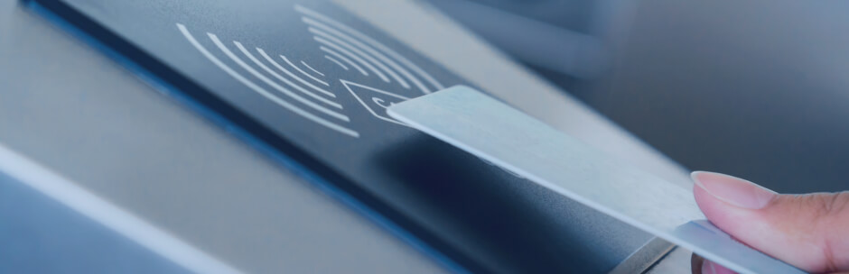 Woman using keycard and Kisi proximity reader